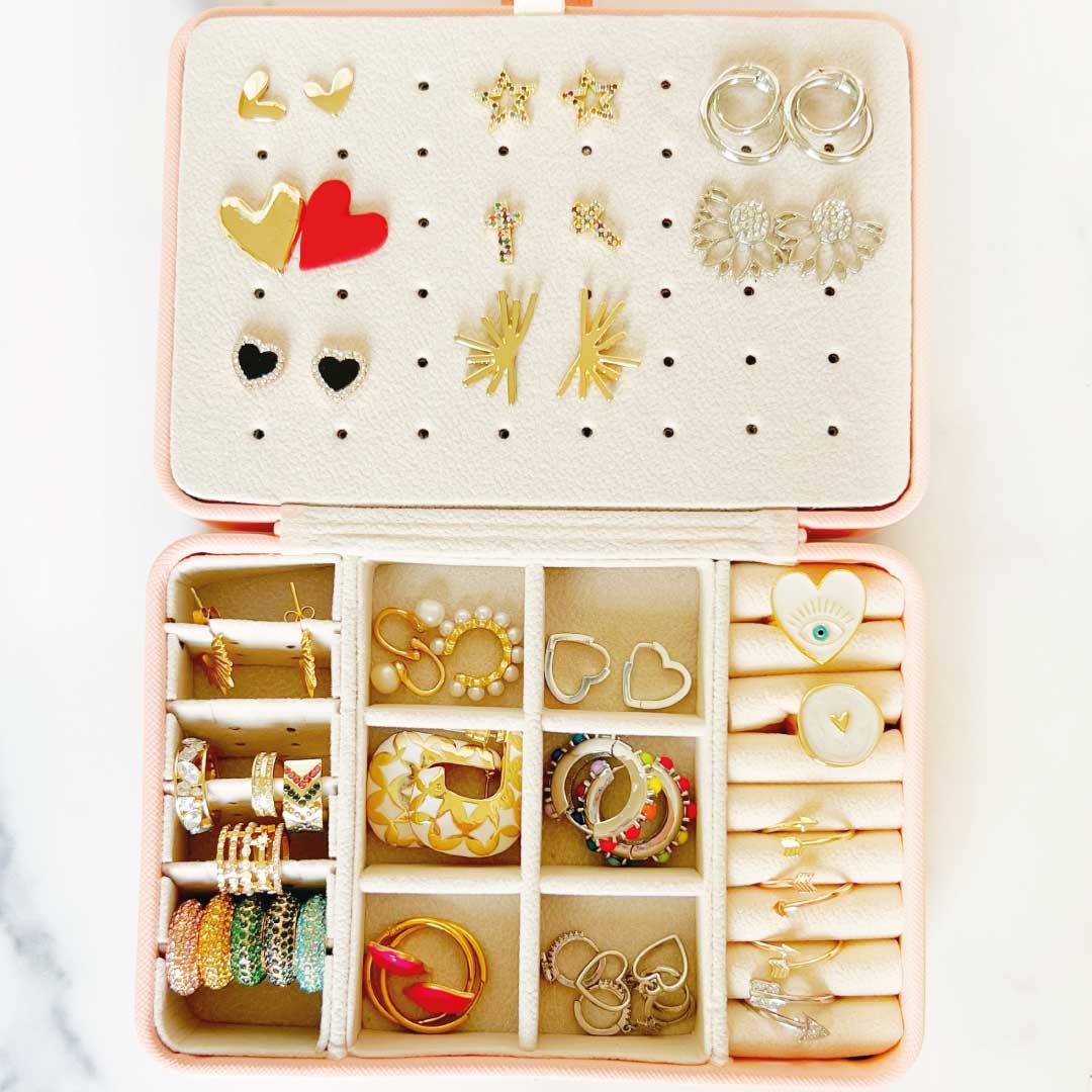 Smart Jewelry Box showcasing organized earrings and rings in a stylish, travel-ready design.