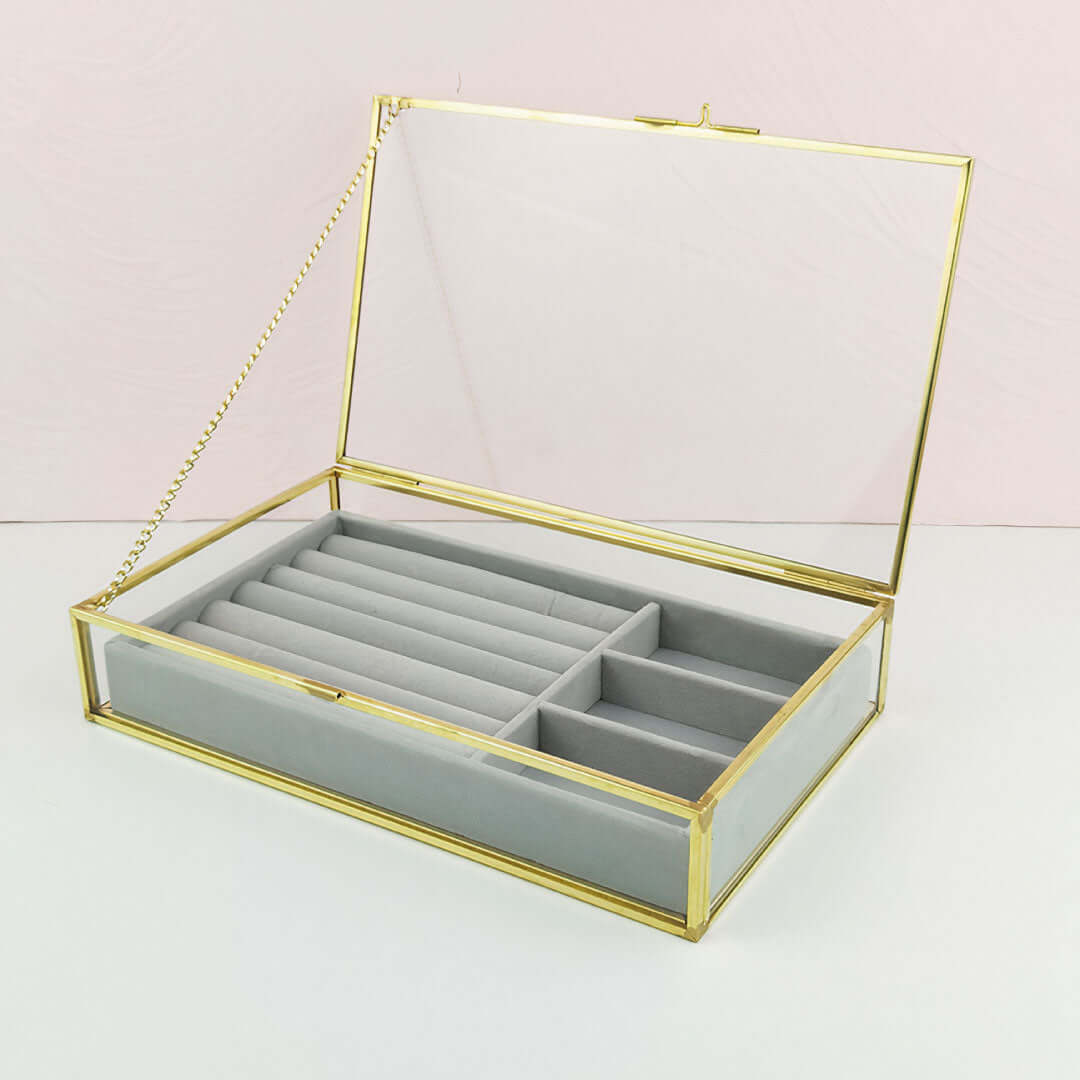 Organizing Jewelry Box with glass top and multiple compartments for stylish storage.
