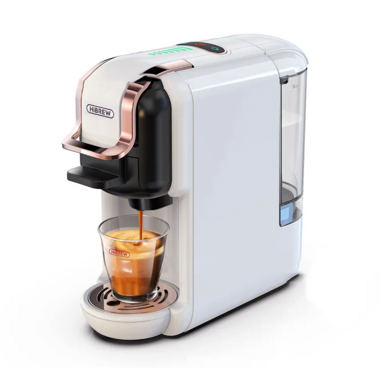 White coffee machine dispensing a glass of coffee on a white background