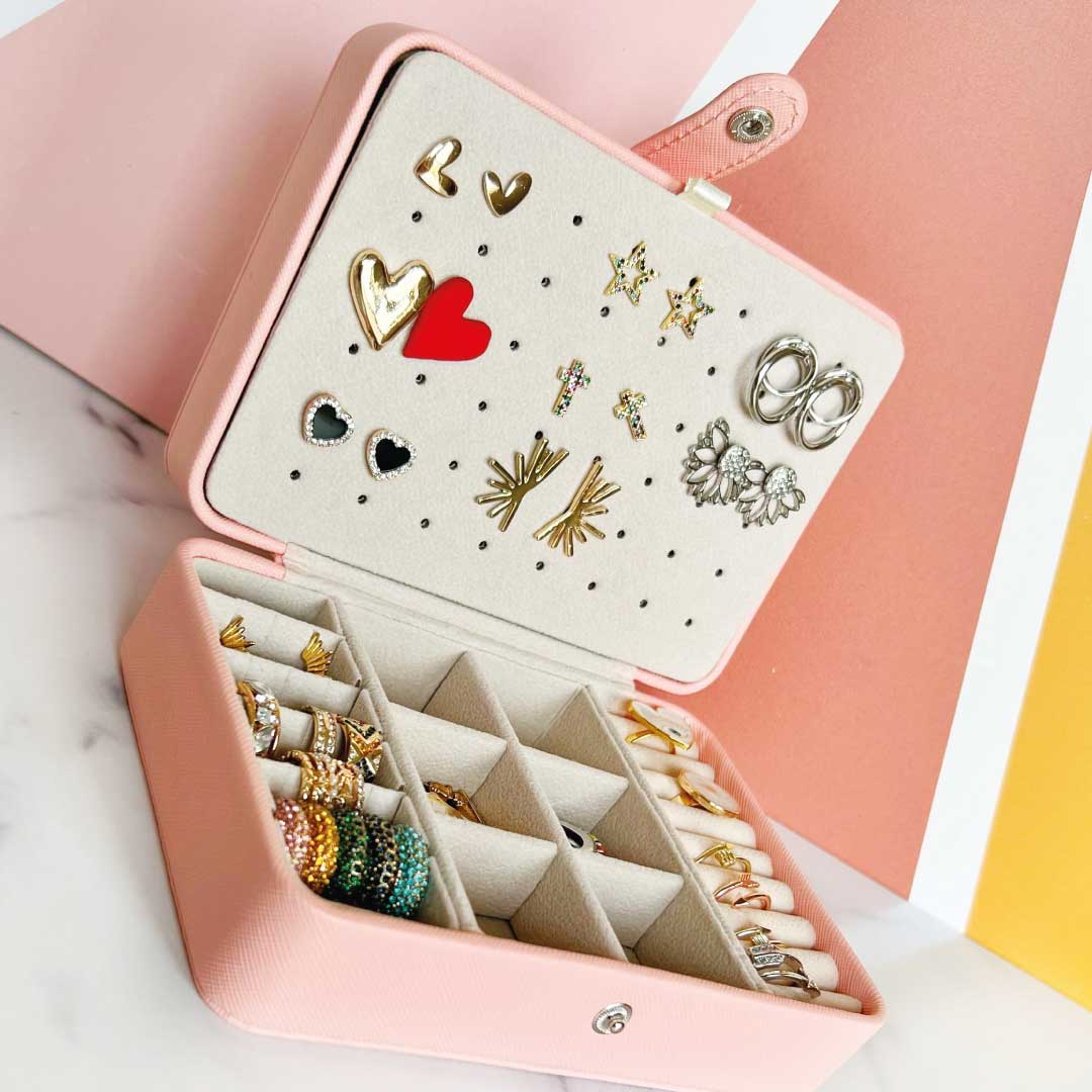 Smart Jewelry Box open showcasing organized earrings, rings, and accessories in a stylish design.