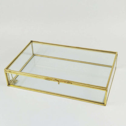 Organizing Jewelry Box with a glass top and gold accents for elegant jewelry storage.
