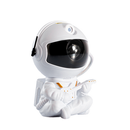 Astronaut Galaxy Projector shaped lamp sitting while playing guitar, projecting colorful stars and nebula effects.