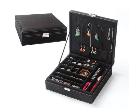 Black Jewelry Box with removable tray and storage for earrings, rings, and necklaces, featuring a lock and key.