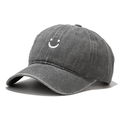 Smile Face Cotton Baseball Cap Adjustable for Women Men in gray color with smiley logo on the front.