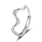 Silver ring with wavy design and small diamonds on a white background