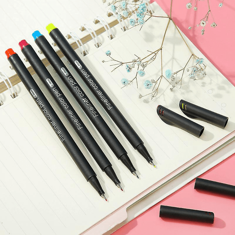 Fine Point Markers displayed on a notebook, showcasing the fine tip art drawing fineliner pens in vibrant colors.