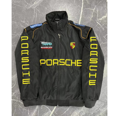 Black Porsche jacket with branding on a textured gray background