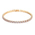 Gold bracelet with clear stones on a white background