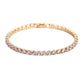 Gold bracelet with clear stones on a white background