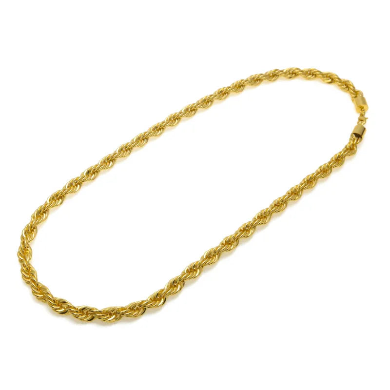 Gold rope chain necklace on a white background