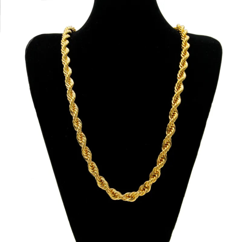 Gold rope chain necklace on a black mannequin bust against a white background