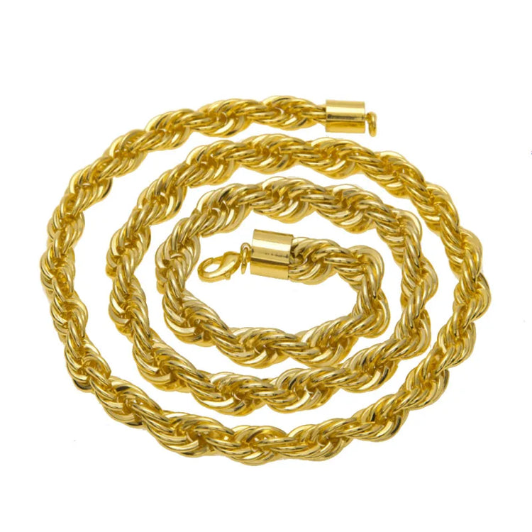 Gold rope chain necklace on a white background