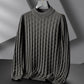 Gray turtleneck sweater on a gray background