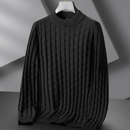 Dark gray sweater on a hanger against a neutral background