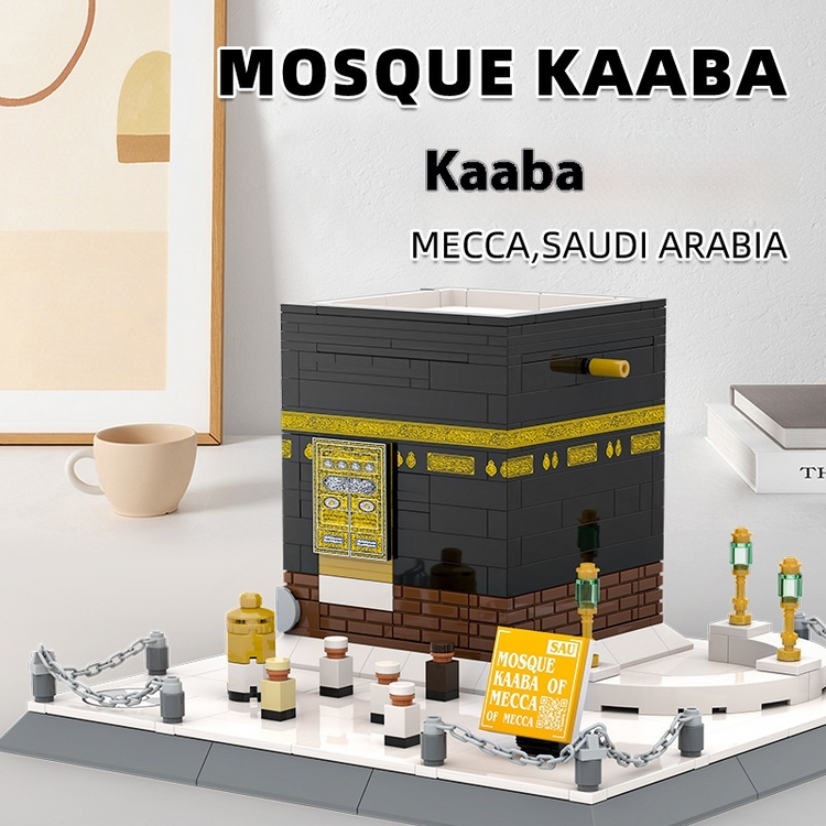 Model of the Kaaba made from interlocking bricks on a white surface with text indicating location.