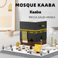 Model of the Kaaba made from interlocking bricks on a white surface with text indicating location.