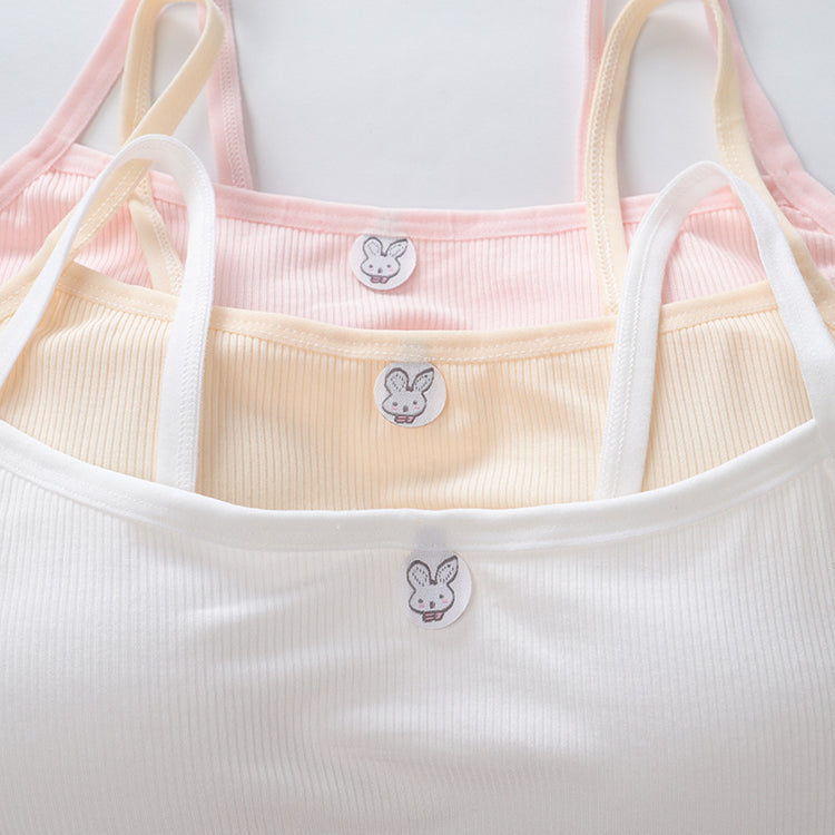 Set of three baby tank tops in pink, yellow, and white with bunny label design on a white background.
