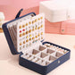 Smart Jewelry Box with a double earring pane and multiple slots for organized jewelry.