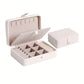 Smart Jewelry Box opened showing compartments for organizing rings, necklaces, and earrings in a stylish design.
