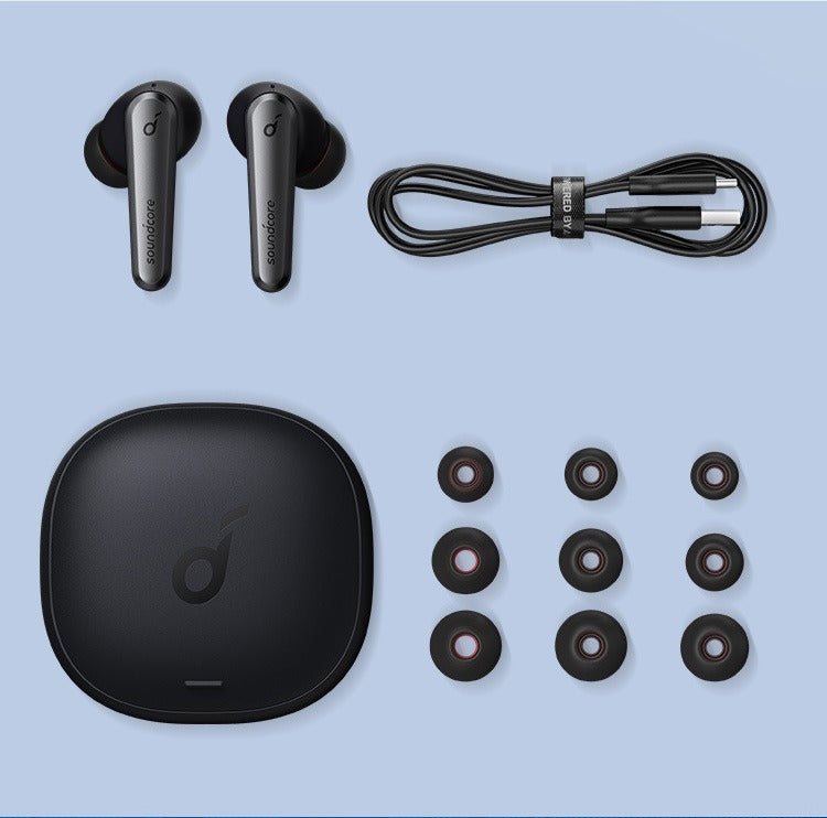 Set of black wireless earbuds, charging case, and accessories on a light blue background