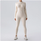 Beige bodysuit worn by a person on a light gray background