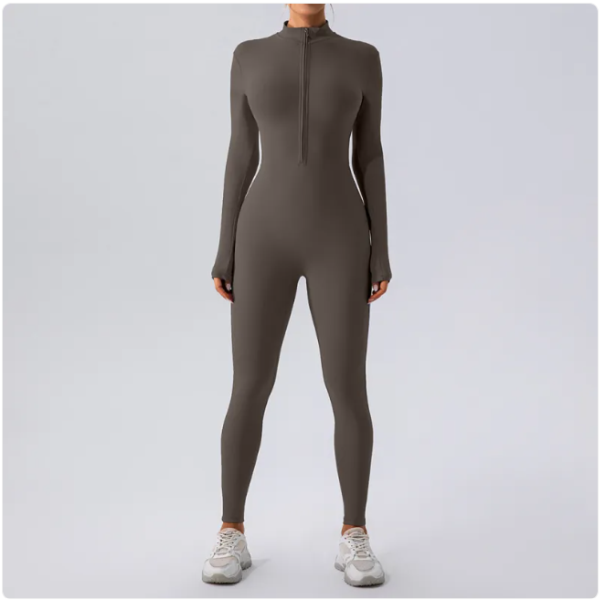Person wearing a gray full-body suit on a light gray background