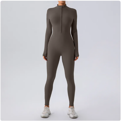 Person wearing a gray full-body suit on a light gray background