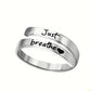 Anillo de corazón en espiral plateado