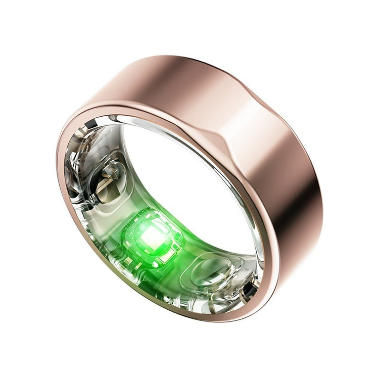 Rose gold ring with a green light on a white background
