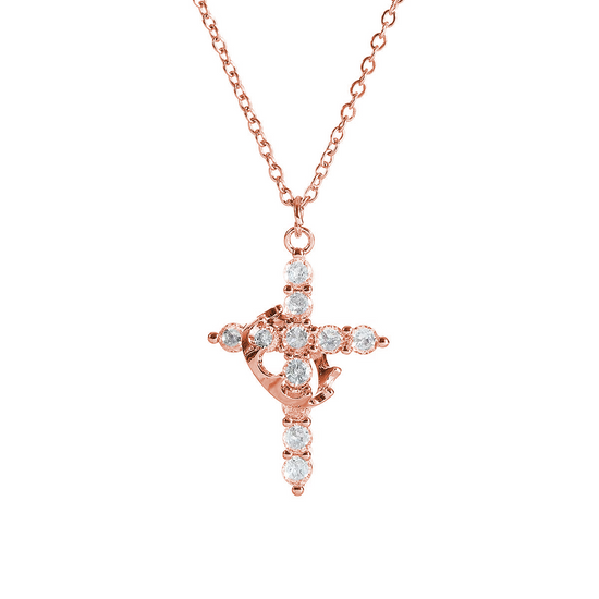 Rose gold cross necklace with clear stones on a white background